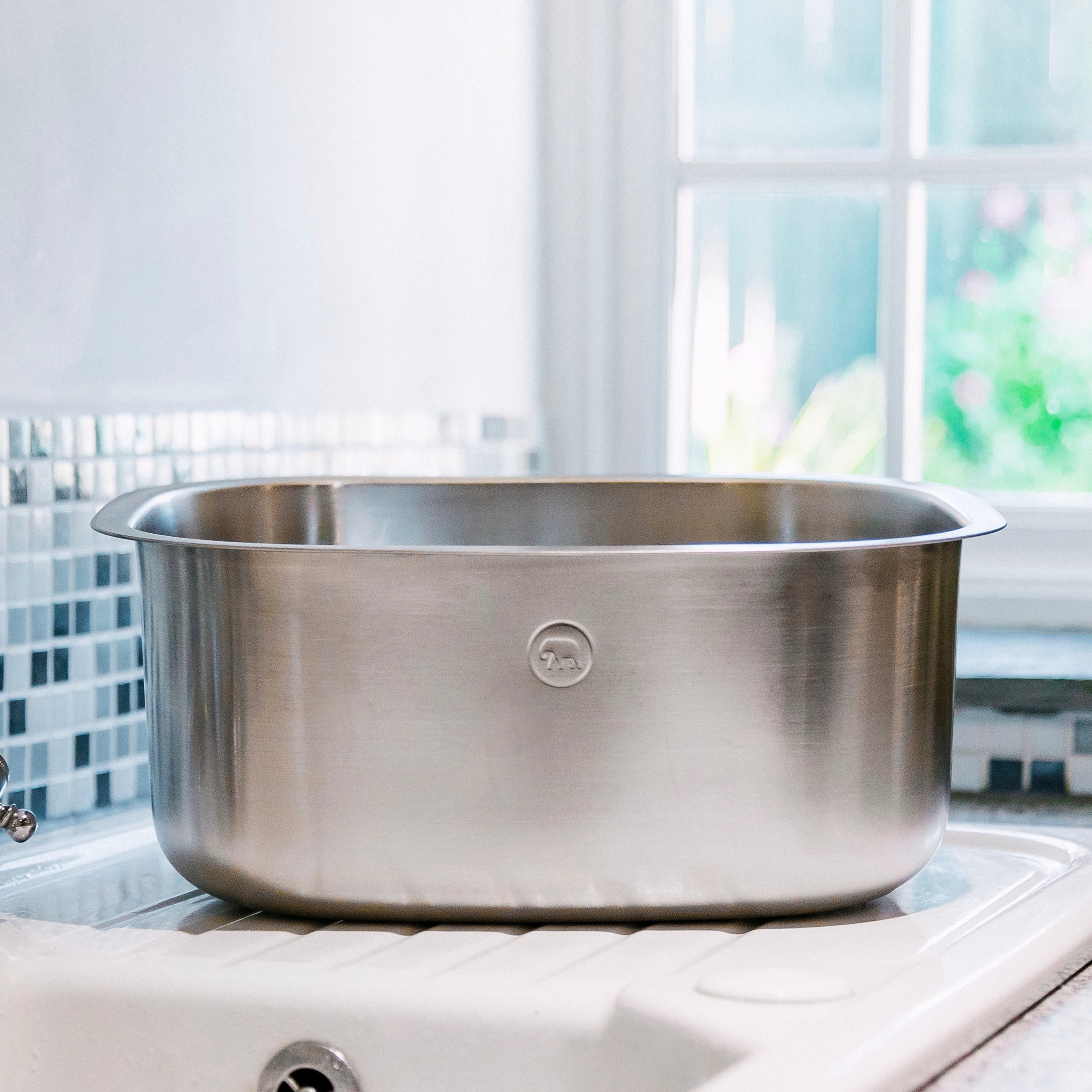 Stainless steel washing up bowl from Elephant Box on a kitchen sink.