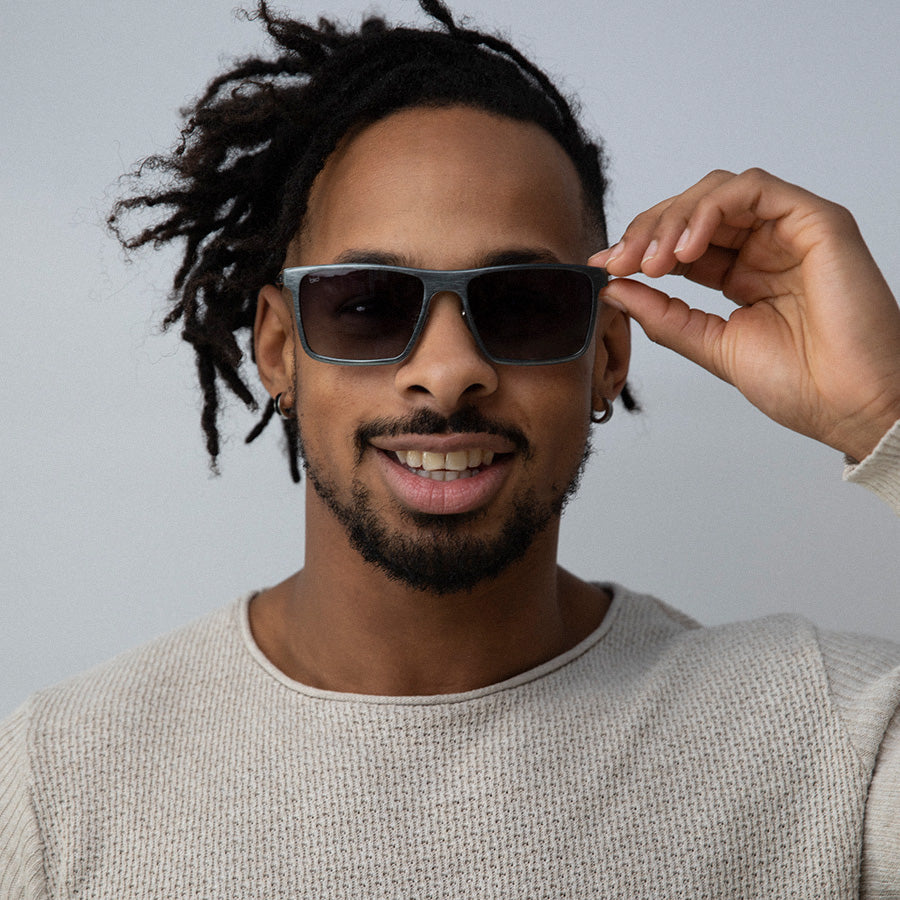 Black man wearing metal rectangle sunglasses