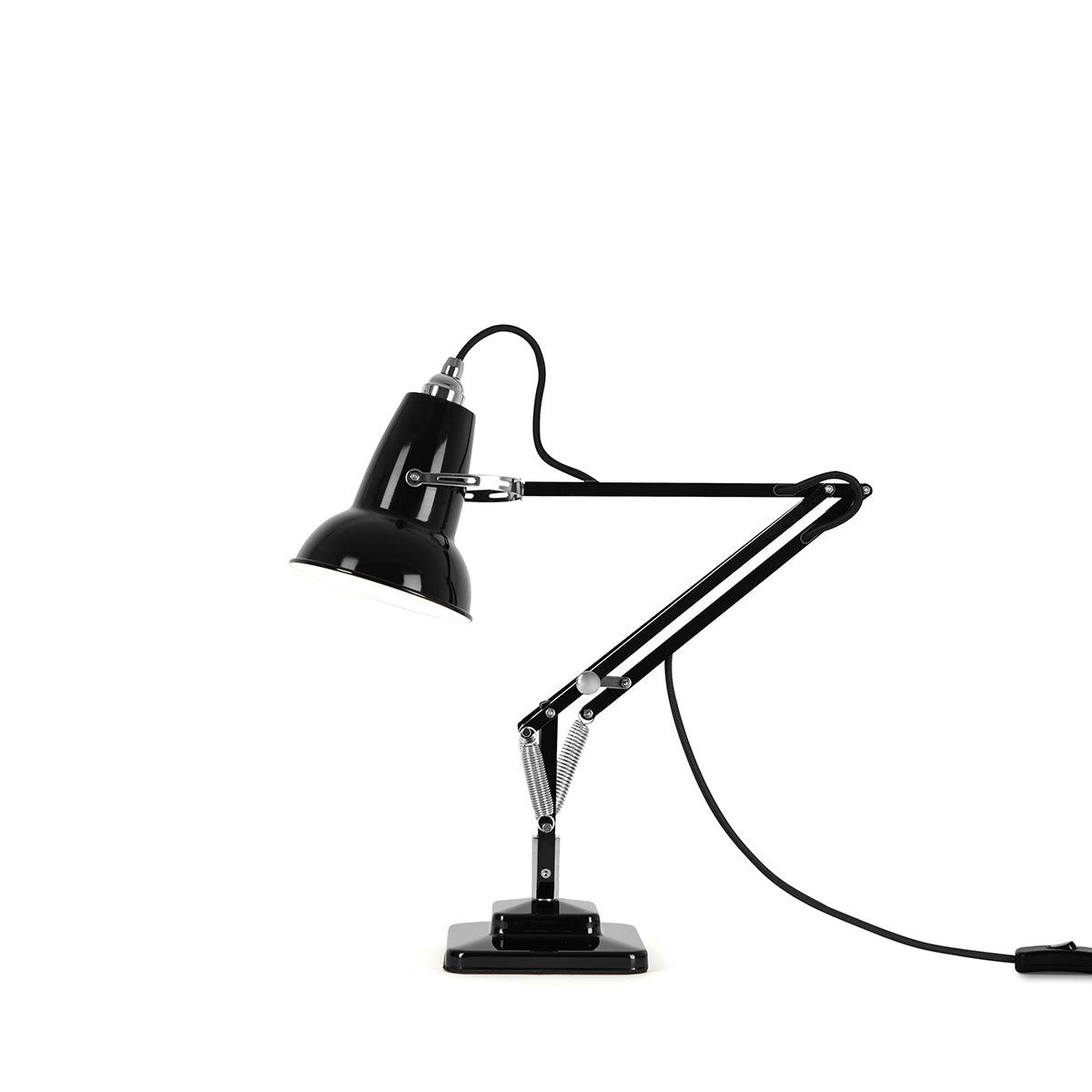 Close-up of premium Jet Black Anglepoise Original 1227 Mini Desk Lamp, showcasing durable metal shade, arm, and silver joint.