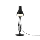 Sleek and durable Anglepoise Type 75 Desk Lamp in Jet Black, turned on. Close-up of premium, long-lasting design.