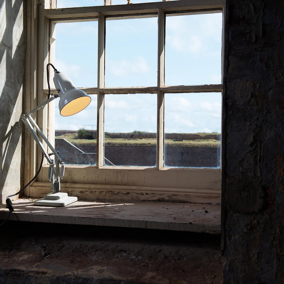 Linen White Anglepoise Original 1227™ Mini Desk Lamp close-up. Adjustable, durable design for sleek home office lighting.