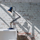 Close-up of Ink Blue Anglepoise Original 1227™ Brass Desk Lamp. Durable, stylish, and perfect for any modern workspace.